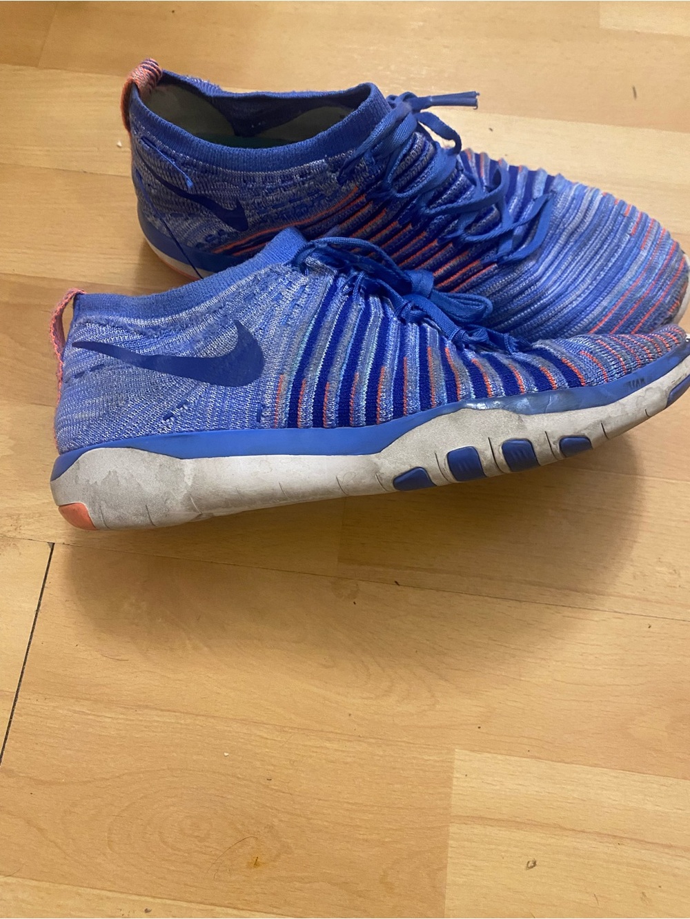 Nike Blue Flyknit Athletic Shoes with Orange Highlights